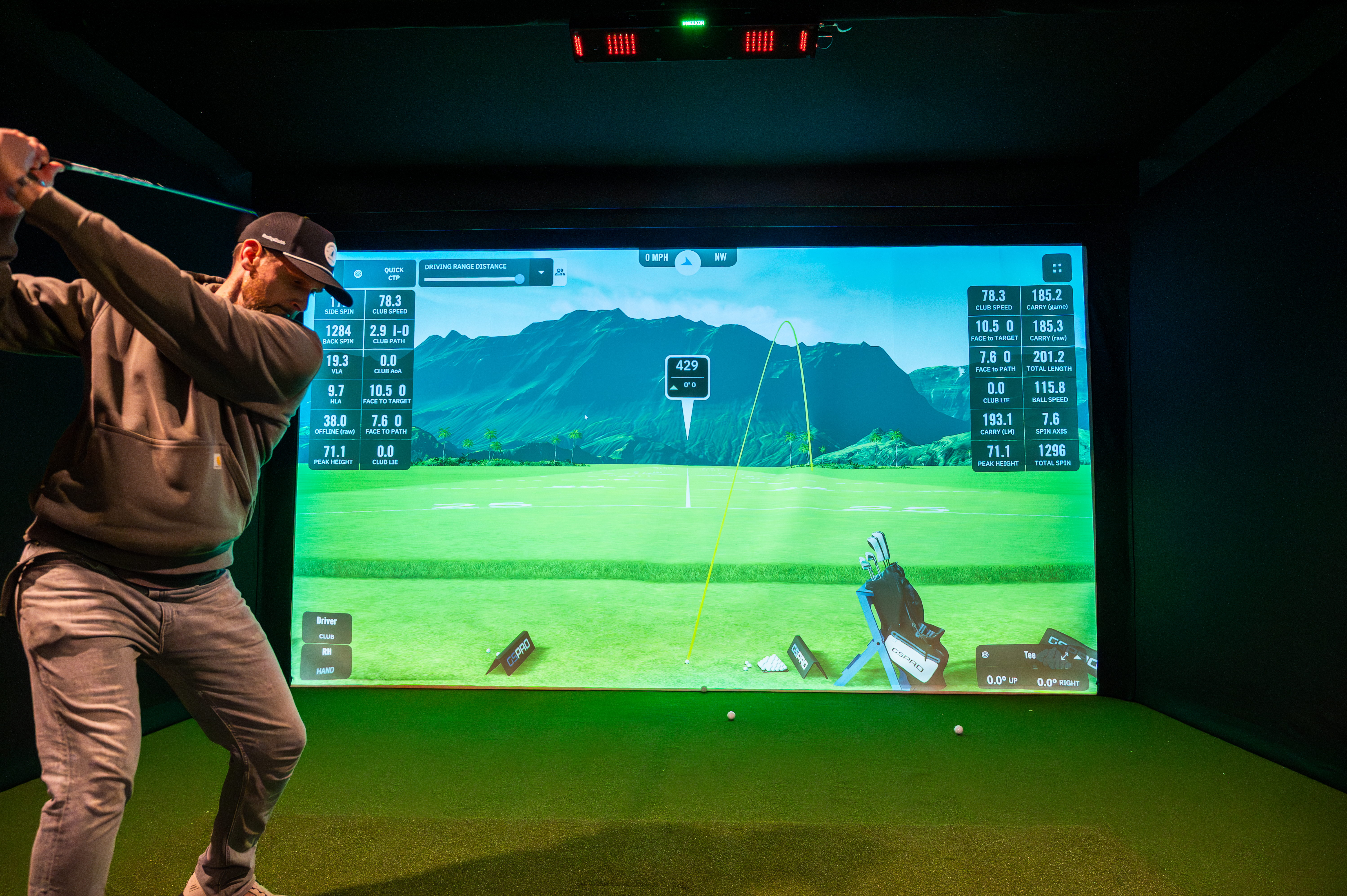 Urban Links Golf Club interior — members enjoying the simulator bay in Fort Thomas, KY